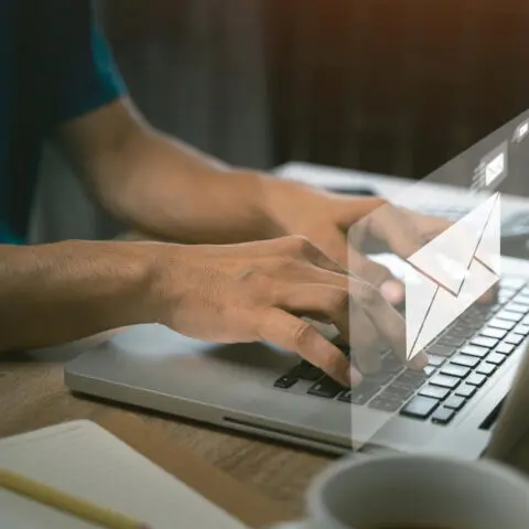 Office worker managing emails efficiently.