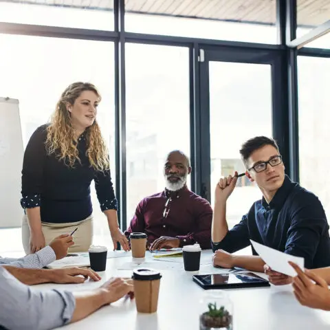 Office workers discussing the election impact