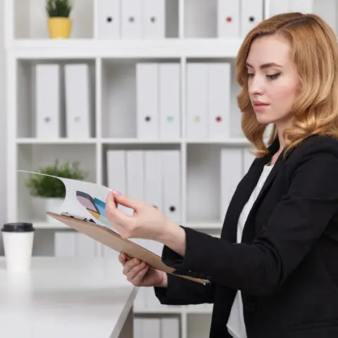 Office professional managing documents and schedules