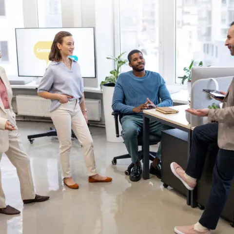 Office manager guiding a team brainstorming session