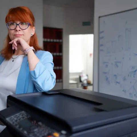 Office copier lifespan: Used copier, hourglass icon, older and newer models. Time to upgrade, maximise efficiency.