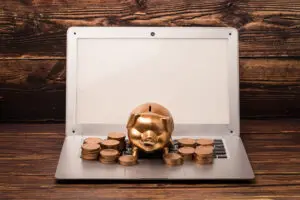 Dusty scanner buried in pound coins shows high Outdated Scanning Software Cost and lost revenue.