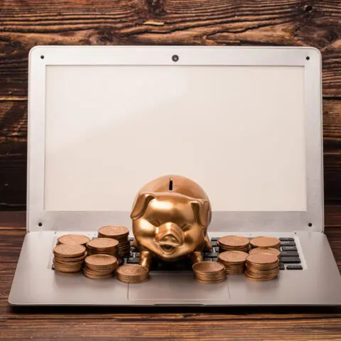 Dusty scanner buried in pound coins shows high Outdated Scanning Software Cost and lost revenue.