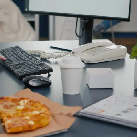 Outdated office equipment cost: Paper-jammed printer and laptop graph show inefficiency. Maximise savings.