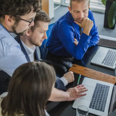 Team members successfully complete a new tech training exercise in an office setting.