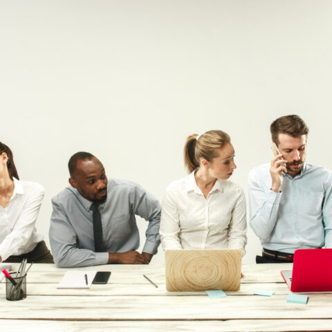 Office environment with employees working at computers