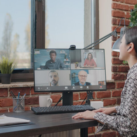 Hybrid office setup with employees working both remotely and in-office.