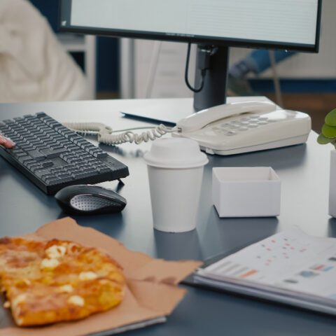 Outdated office equipment cost: Paper-jammed printer and laptop graph show inefficiency. Maximise savings.