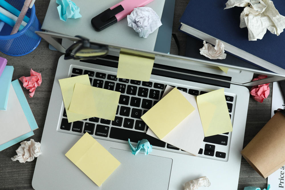 A frustrated office worker searches through disorganized digital files on a computer screen.
